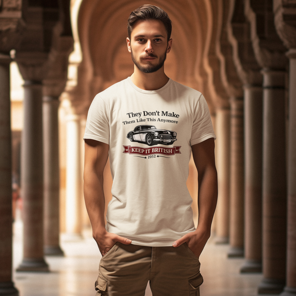 Man wearing a natural t-shirt with a graphic Healey car design in an architectural setting