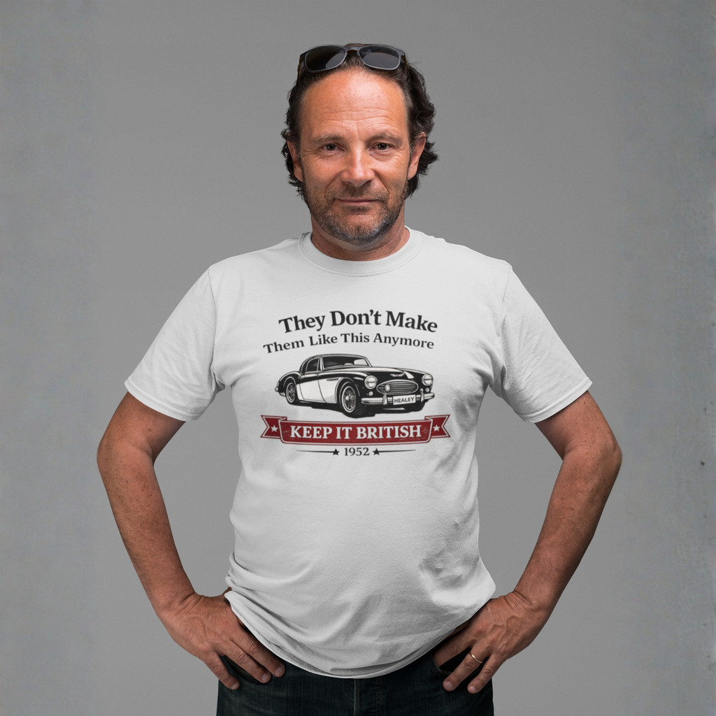 Man wearing a white t-shirt with a graphic Healey design and text on a gray background