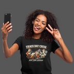 Woman wearing a 'Track Day Crew' t-shirt and taking a selfie.
