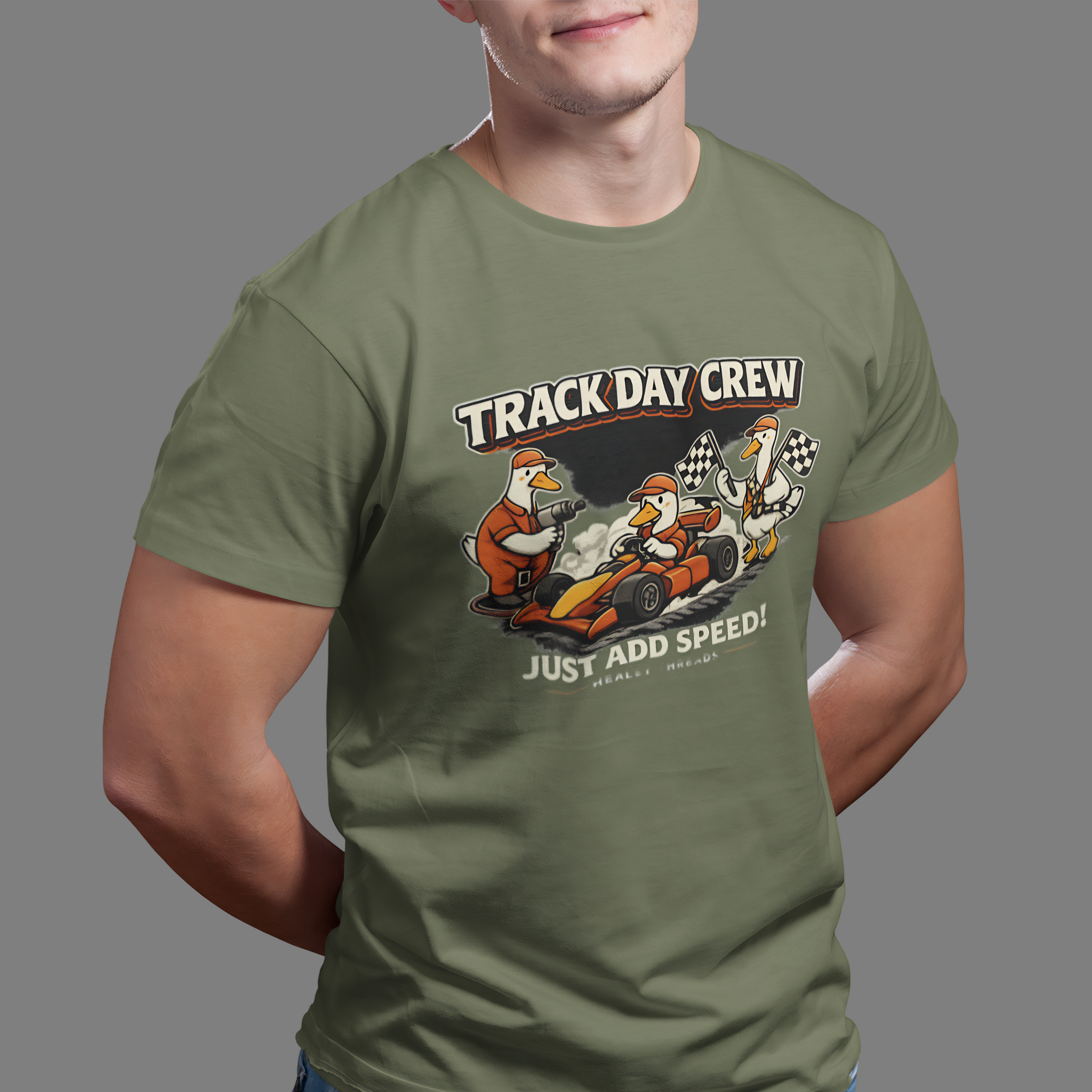 Man wearing a military green t-shirt with 'Track Day Crew' graphic design.