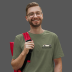 Man wearing a military green t-shirt with a Healey classic car graphic design on a gray background