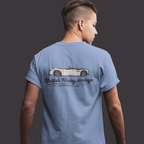 Back of a man wearing a blue t-shirt with a Healey classic car graphic design on a gray background