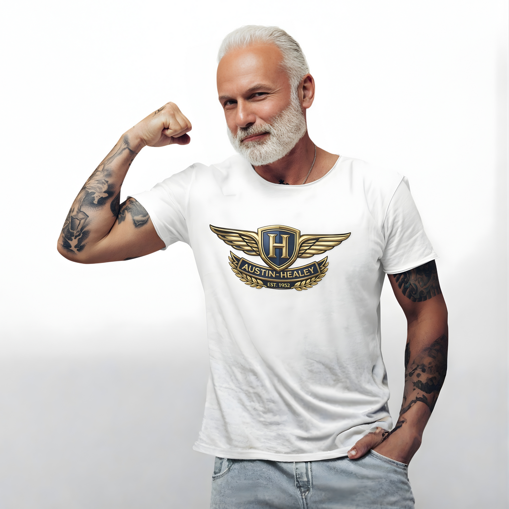 Man wearing a white t-shirt with an Austin-Healey logo, flexing his arm on a plain background