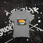 Big Healey graphic gray colored t-shirt featuring a blue and white Austin Healey roadster with retro sunset artwork and vintage British sports car hanging against a wall.