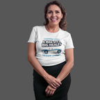 Woman wearing a white t-shirt with a Healey graphic and text on a gray background