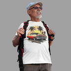 Man wearing a white t-shirt with a classic car and palm tree design, holding a backpack on a gray background