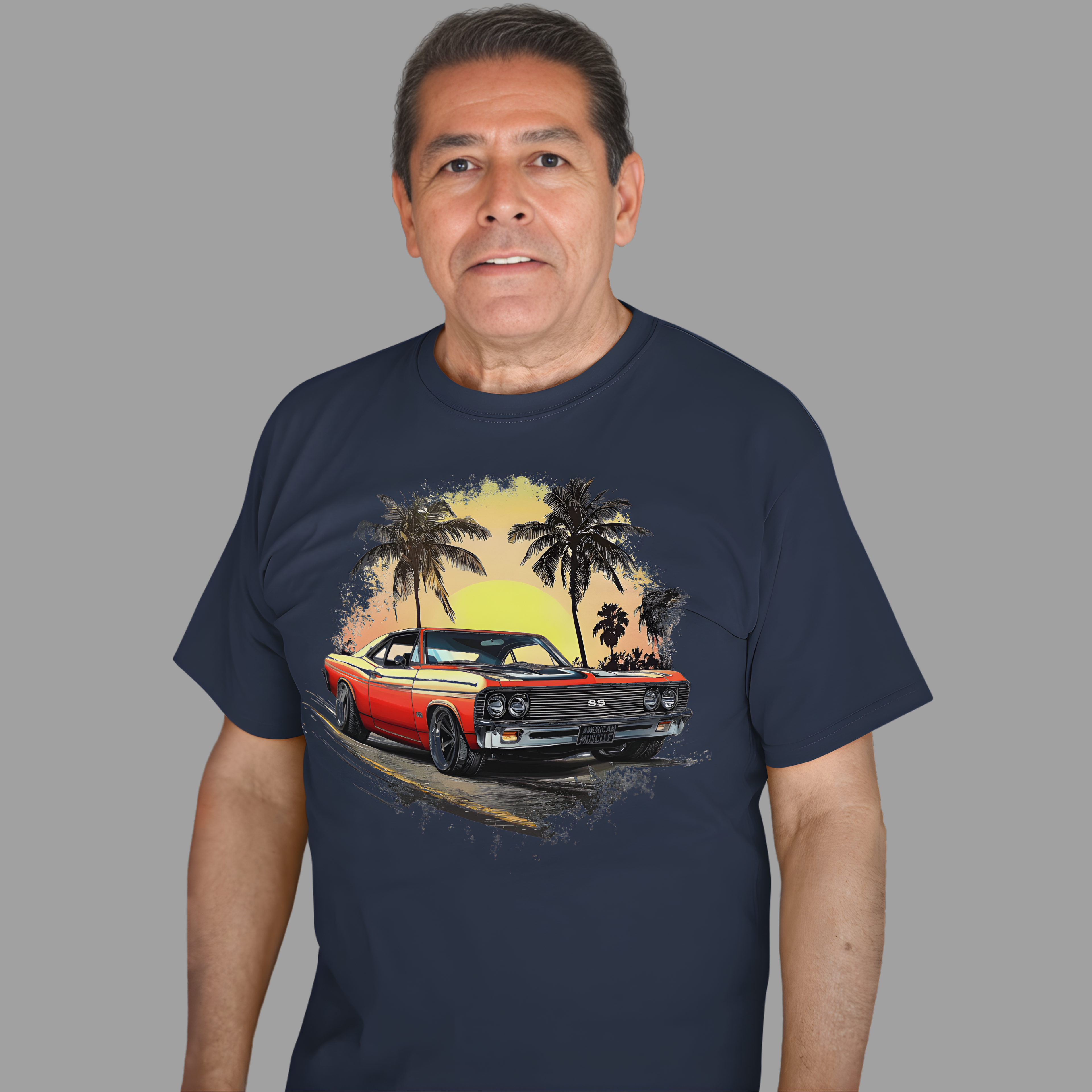Man wearing a navy blue t-shirt with a graphic of a red classic car and palm trees.
