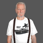 Man wearing a white t-shirt with a graphic design of a car and palm trees, text 'American Muscle' on a gray background.