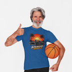 Man wearing a royal blue t-shirt with 'American Muscle' graphic design, holding a basketball.