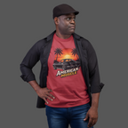 Man wearing a red t-shirt with 'American Muscle' graphic design on a gray background
