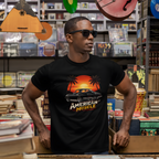 Man wearing a black t-shirt with 'American Muscle' graphic in a store setting