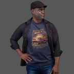 Man wearing a navy blue t-shirt with 'American Muscle' graphic design on a gray background