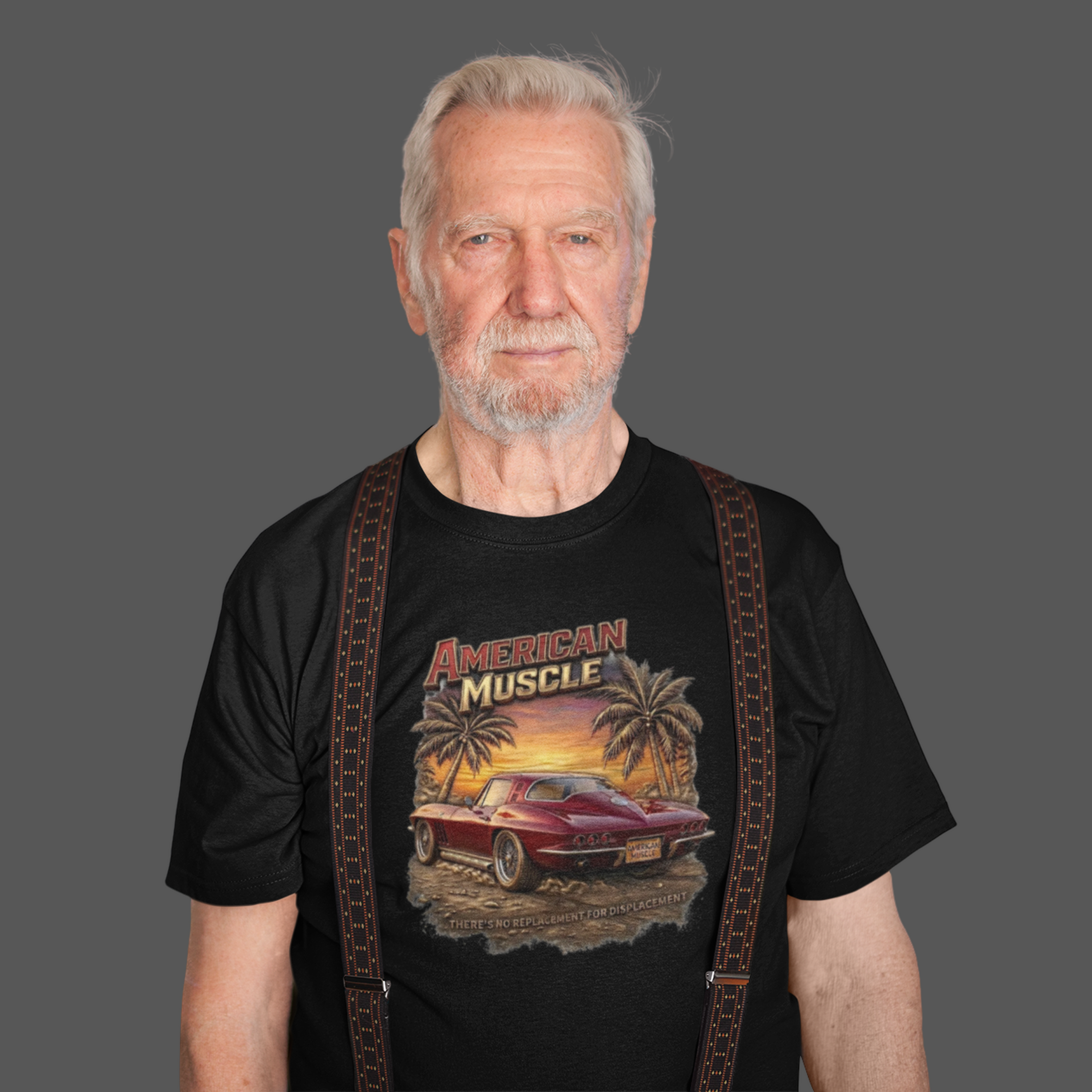 Man wearing a black t-shirt with 'American Muscle' graphic design on a gray background