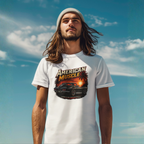 Man wearing a white t-shirt with 'American Muscle' car graphic against a blue sky.
