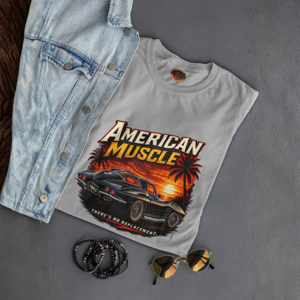 Sport gray t-shirt with 'American Muscle' car graphic design, denim jacket, sunglasses, and bracelets on a gray surface.