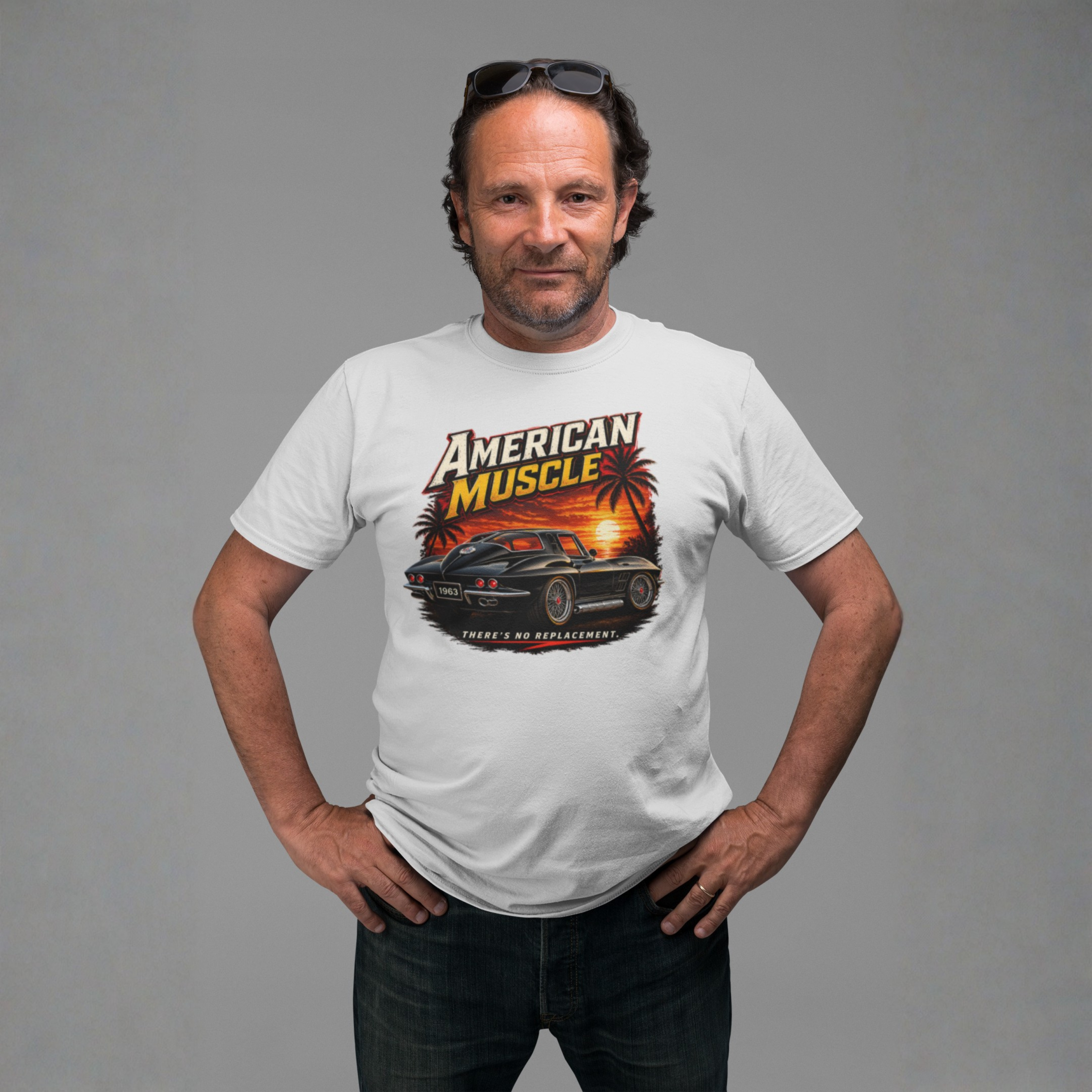 Man wearing a white t-shirt with an 'American Muscle' car graphic design on a gray background