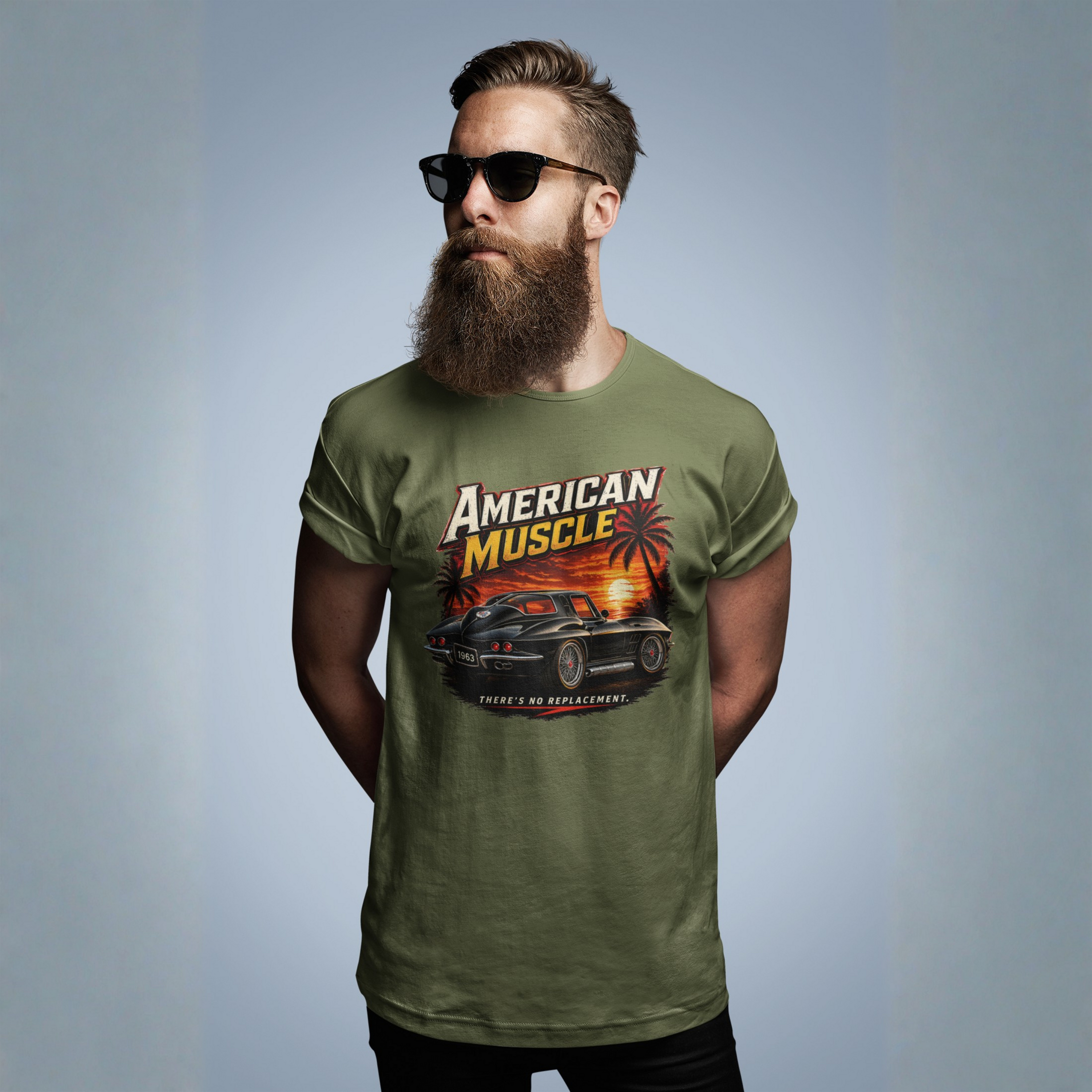 Man wearing a military green t-shirt with an 'American Muscle' graphic design on a gray background