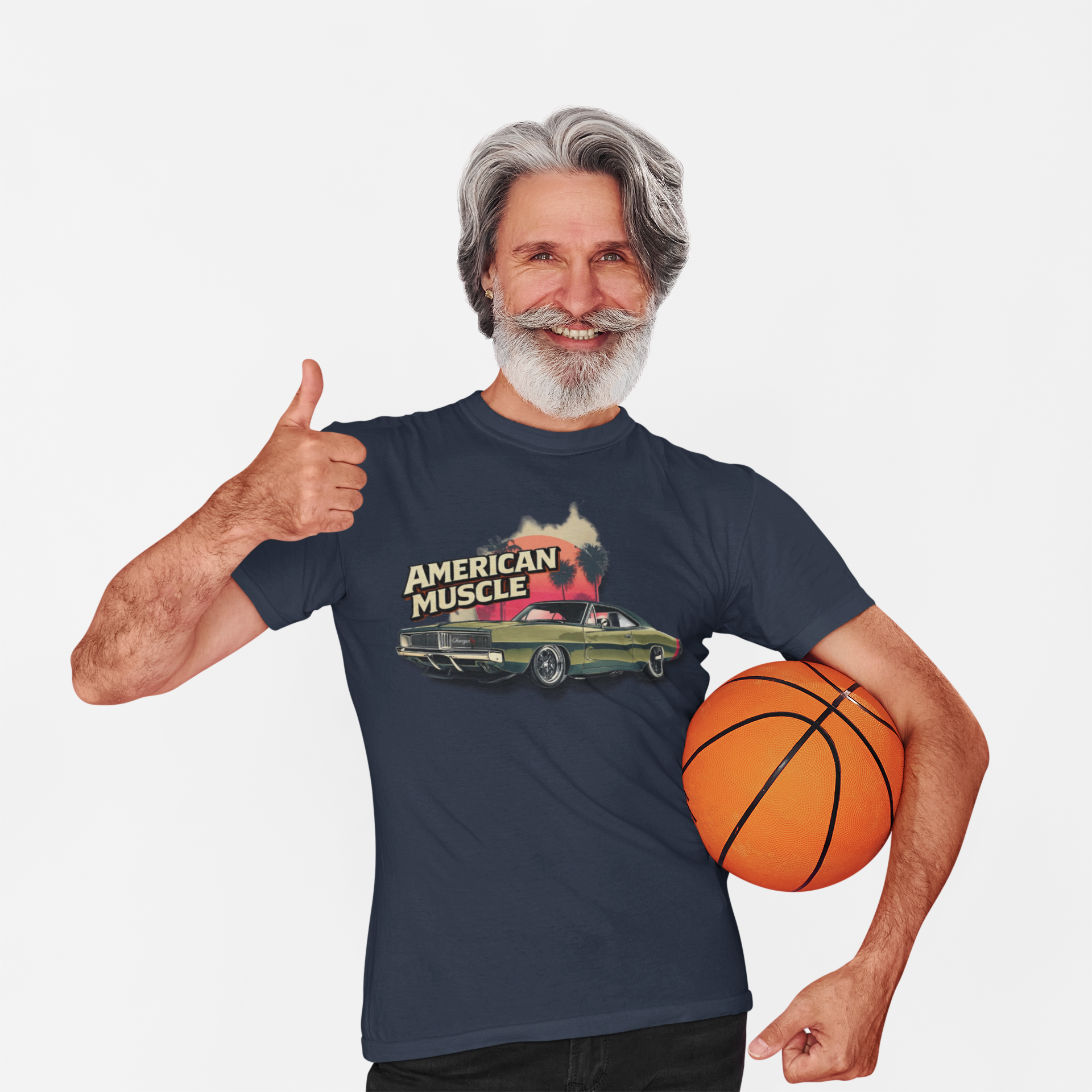 Man wearing a navy blue t-shirt with 'American Muscle' graphic design, holding a basketball.