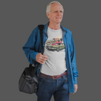 Man wearing a 'American Muscle' t-shirt with a blue jacket and carrying a black bag on a gray background