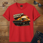 Red t-shirt with 'American Muscle' graphic on a wooden surface with sunglasses and keys.