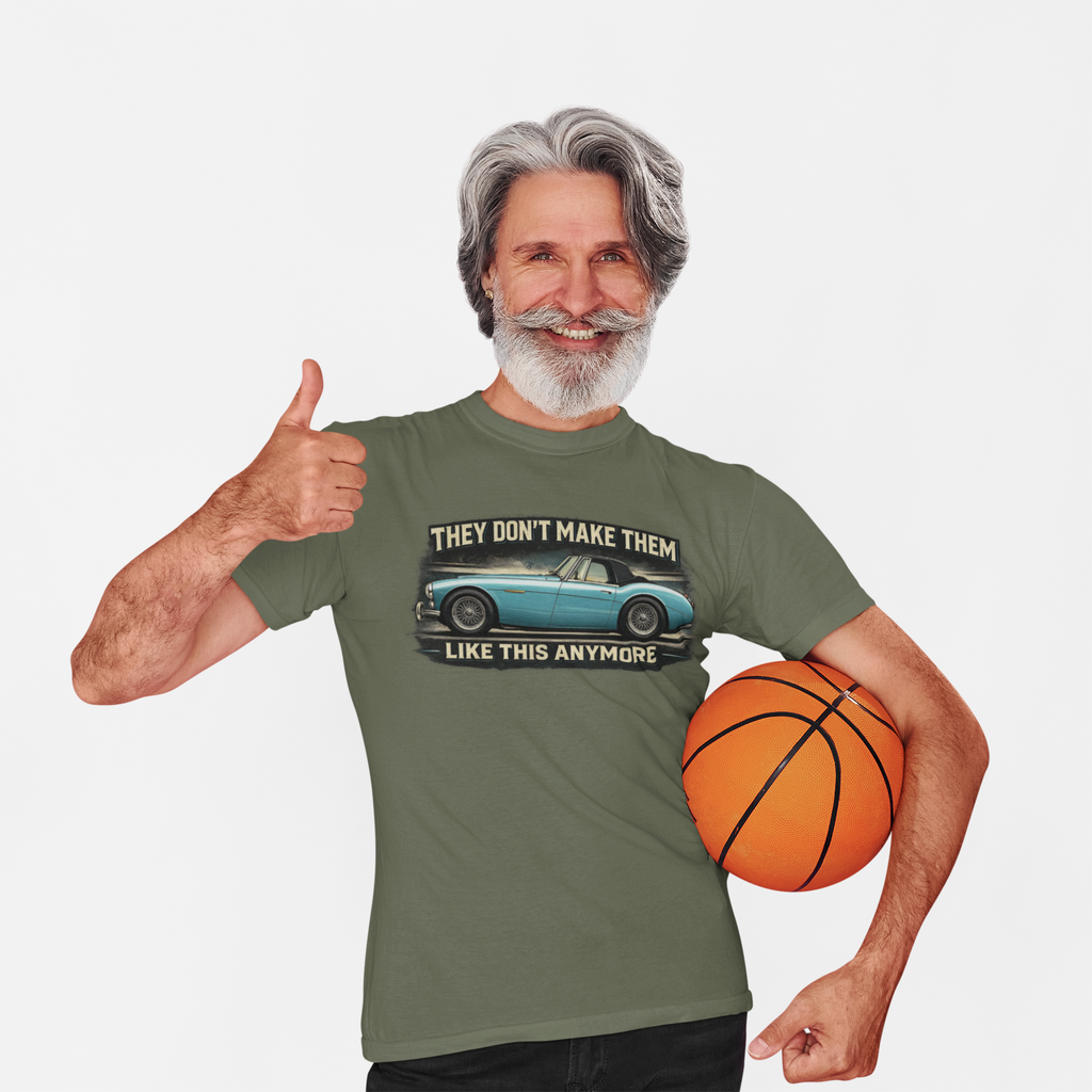 Man wearing a military green t-shirt with a Healey graphic and text, holding a basketball on a white background