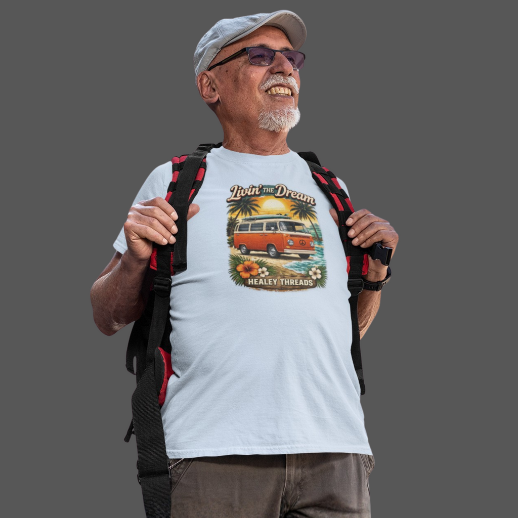 Man wearing a t-shirt with a graphic design of a van and text, holding a backpack on a gray background