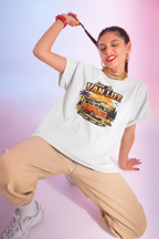 Woman wearing a 'Van Life' white t-shirt with a colorful graphic on a gradient background