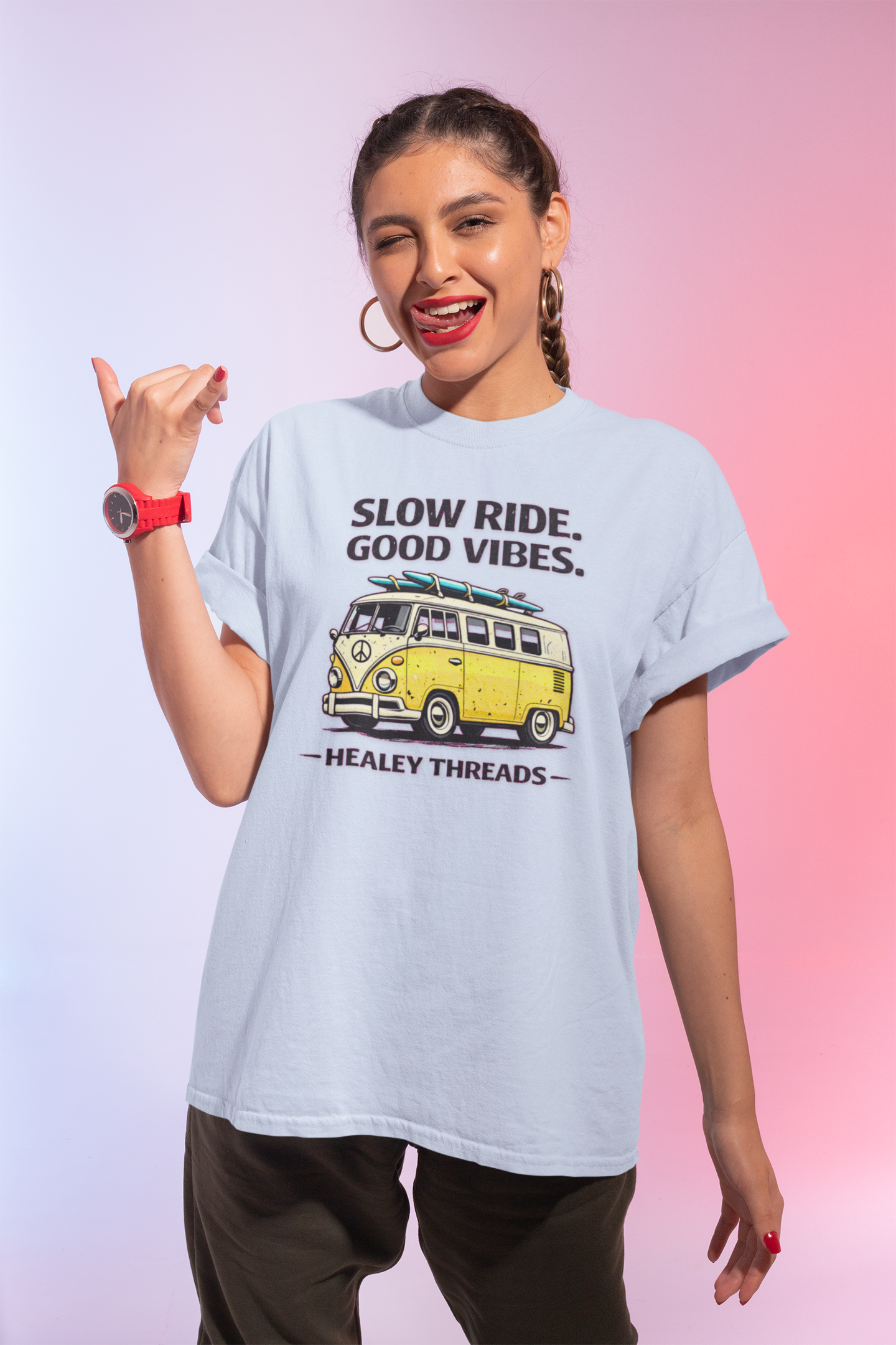 Woman wearing a light blue t-shirt with a graphic and text, posing against a gradient background.