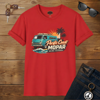 Red t-shirt with a graphic design of a van, palm trees, and text on a wooden background.