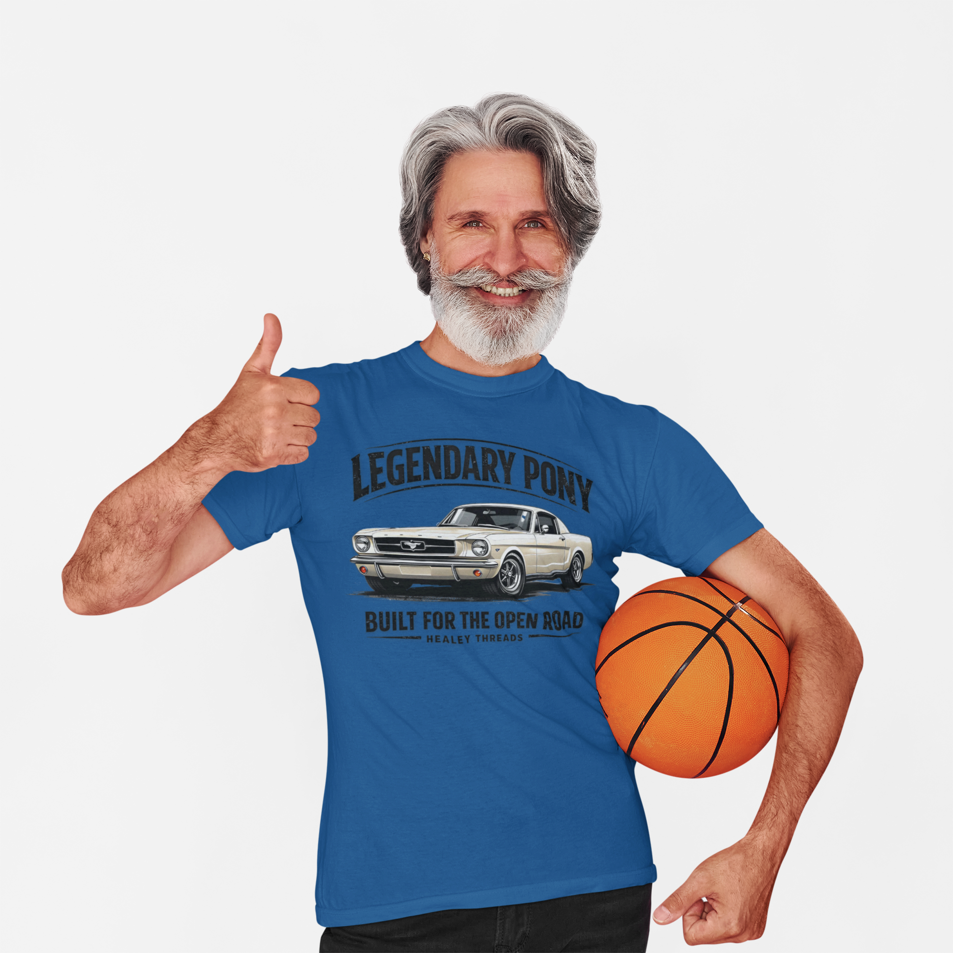 Man wearing a royal blue t-shirt with a classic car graphic and holding a basketball, giving a thumbs-up.