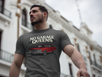Man wearing a gray t-shirt with 'No Garage Queens' and a car graphic, standing in an urban setting.