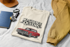 Natural t-shirt with 'No Garage Queens' graphic on a white surface with accessories.