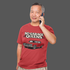Man wearing a red t-shirt with a graphic and text, talking on a phone against a gray background
