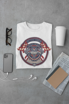 White t-shirt with a graphic Healey Sprite design on a gray surface with a phone, cup, and glasses.