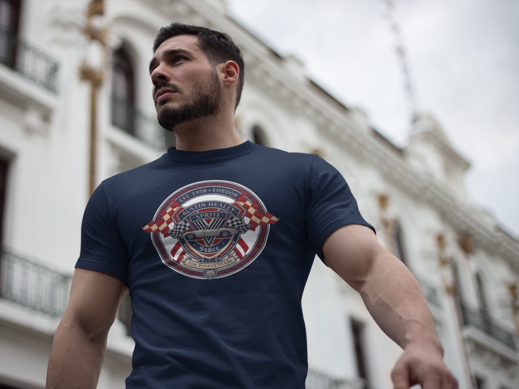 Man wearing a navy blue t-shirt with a circular Healey Sprite graphic design in an urban setting