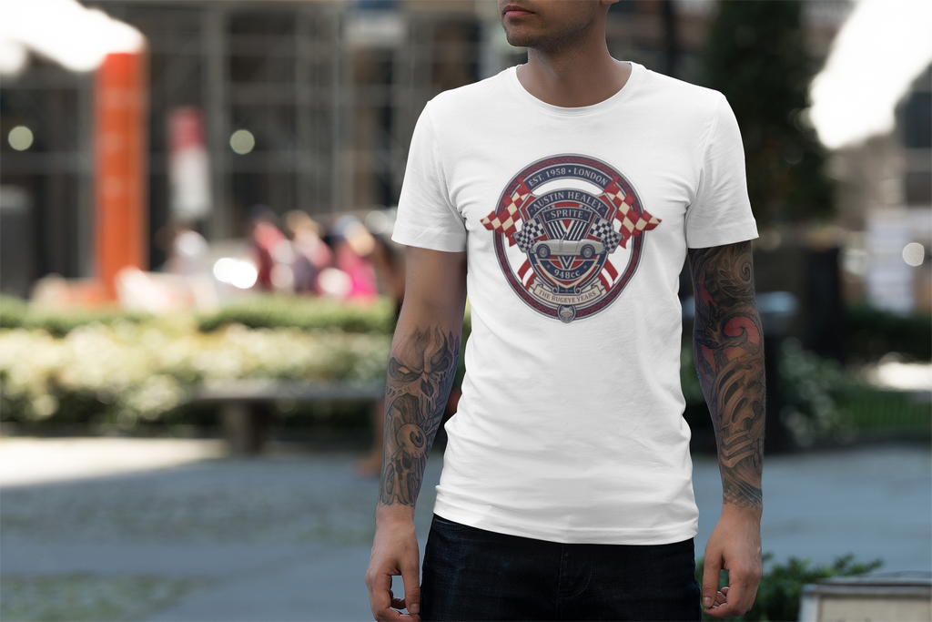 Man wearing a white t-shirt with a red, white, and blue Healey Sprite graphic design outdoors.