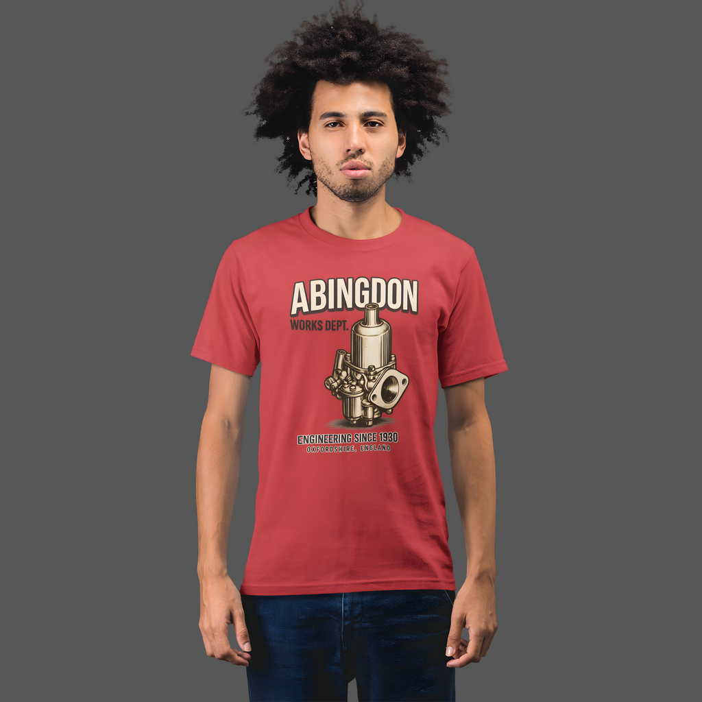 Man wearing a red t-shirt with 'Abingdon Works Dept.' graphic design on a plain background