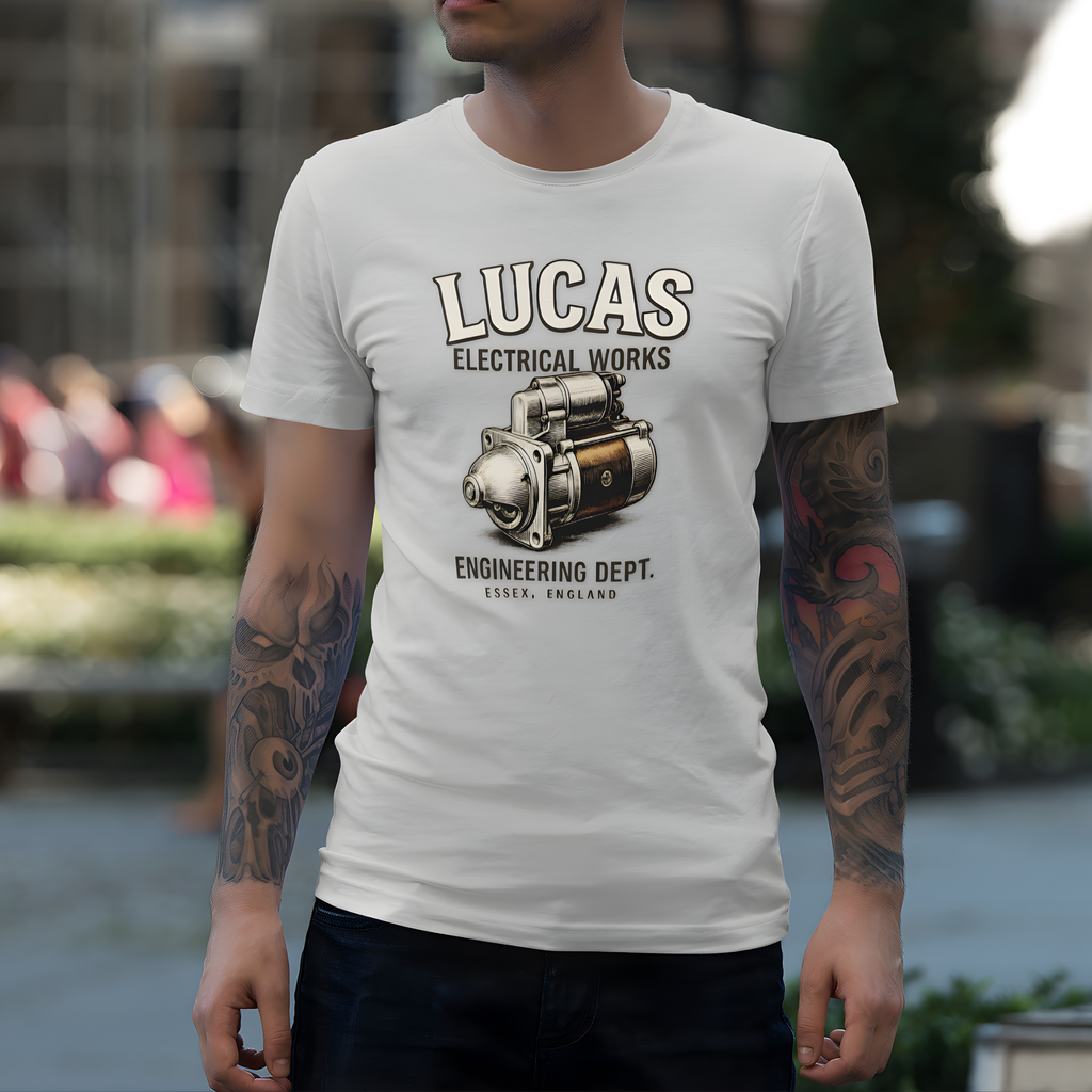 Man wearing a white t-shirt with 'Lucas Electrical Works' design outdoors.