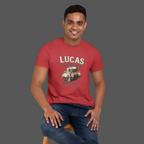 Man wearing a red t-shirt with 'Lucas Electrical Works' graphic on a gray background