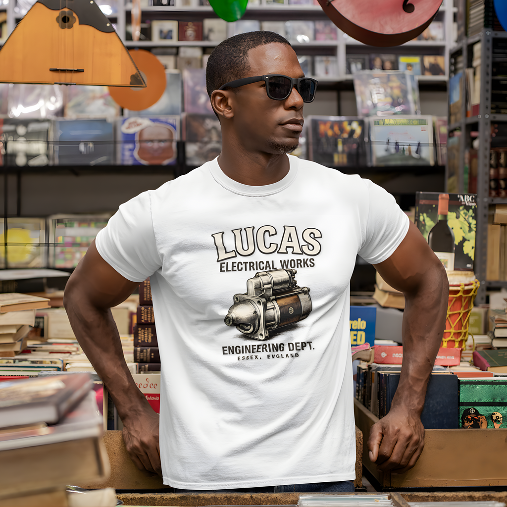 Man wearing a white t-shirt with 'Lucas Electrical Works' design in a record store.