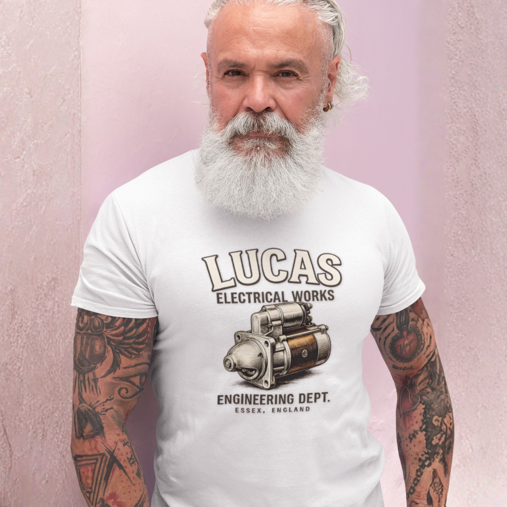 Man wearing a white t-shirt with 'Lucas Electrical Works' design against a pink background