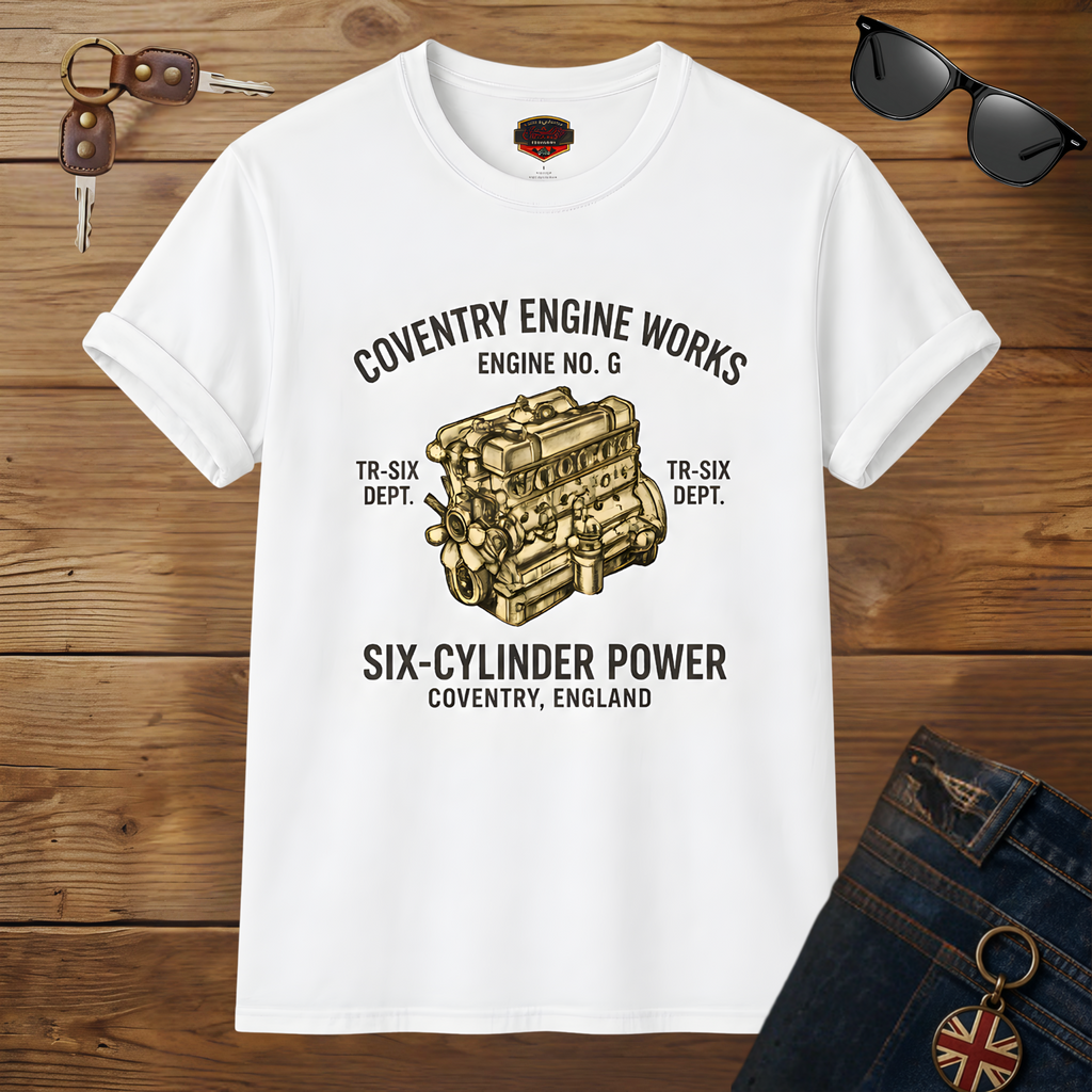 White t-shirt with Coventry Engine Works graphic on a wooden surface with sunglasses and keys.