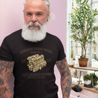 Man wearing a black t-shirt with 'Coventry Engine Works'  graphic and text, standing indoors.