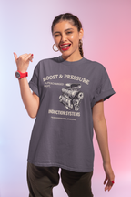 Woman wearing a gray t-shirt with supercharged engine graphic and text on a gradient background