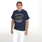 Man wearing a navy blue t-shirt with a mechanical graphic design and text on a white background
