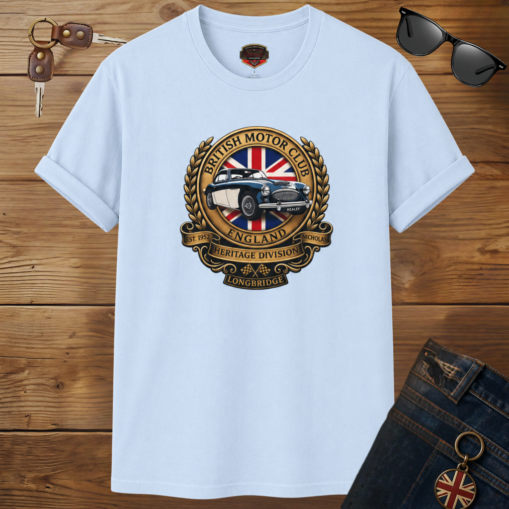 Light blue t-shirt with British Motor Club logo on a wooden surface with sunglasses and keys.