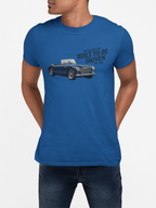 Man wearing a blue t-shirt with a graphic of a Healey car and text on a white background