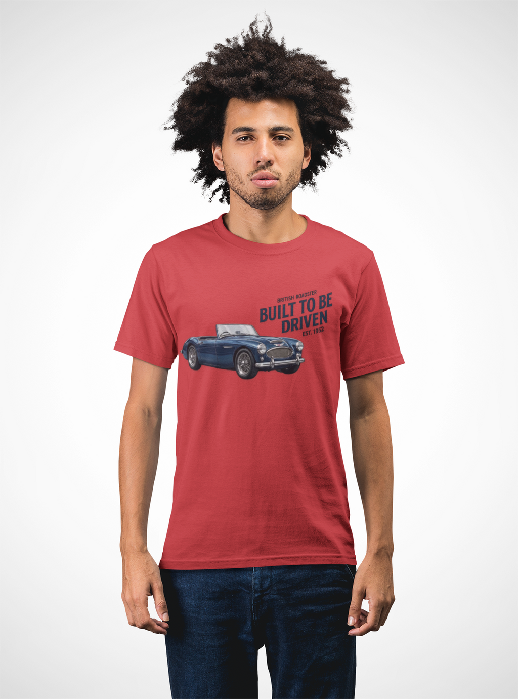 Man wearing a red t-shirt with a graphic of a Healey car and text on a white background