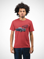 Man wearing a red t-shirt with a graphic of a Healey car and text on a white background