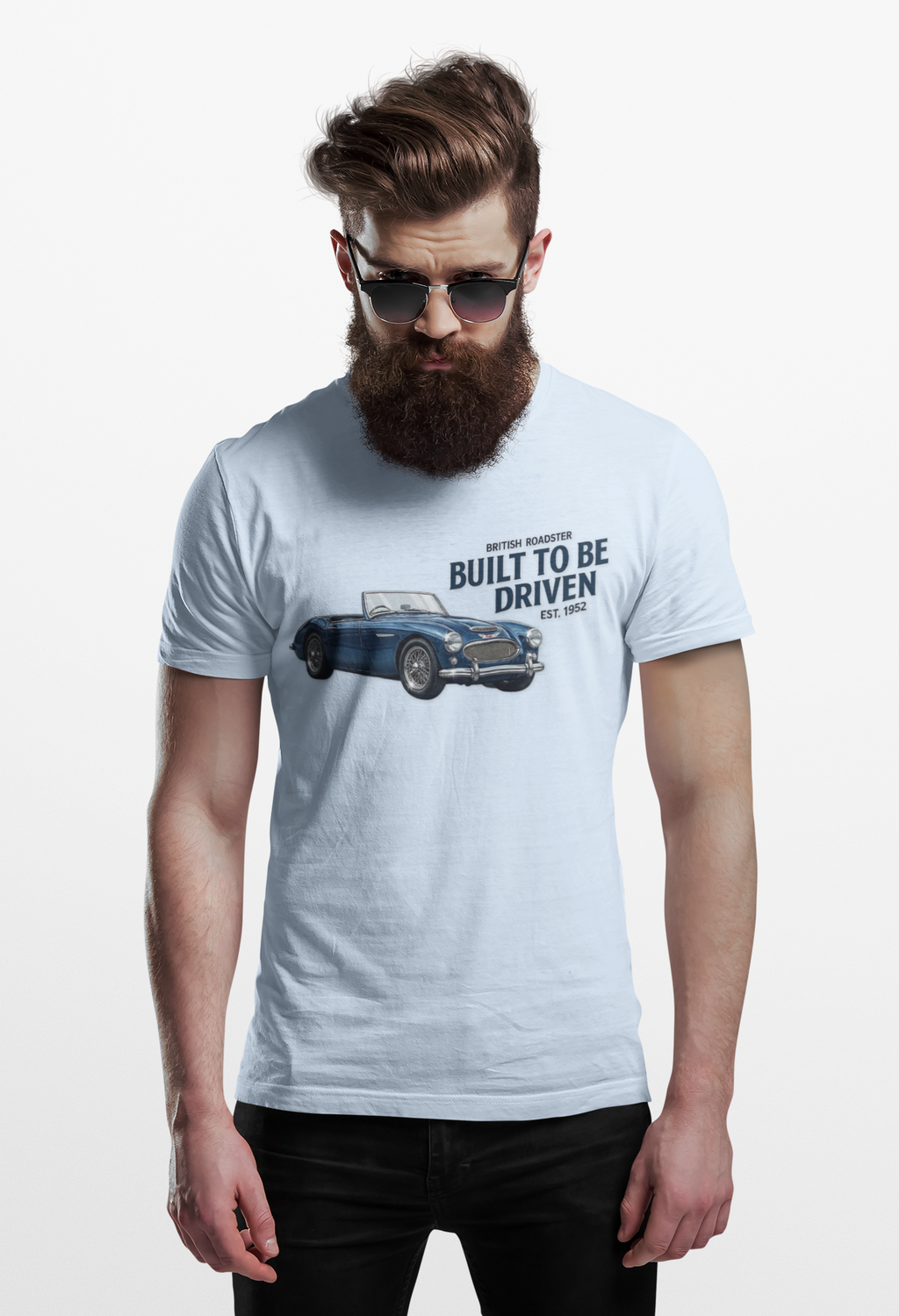 Man wearing a light blue t-shirt with a Healey car graphic and text on a white background